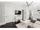 Inviting living room with a ceiling fan, dark wood floors, and neutral decor for a comfortable living space at 255 Marjean Way, Alpharetta, GA 30009