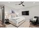 Inviting bedroom features an area rug, a ceiling fan, and a mounted television at 255 Marjean Way, Alpharetta, GA 30009