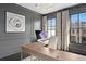 Elegant office space with dark gray walls, modern lighting, and large windows overlooking the neighborhood at 255 Marjean Way, Alpharetta, GA 30009