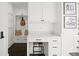 Charming office nook includes built-in desk, storage, and decor, creating a functional workspace at 255 Marjean Way, Alpharetta, GA 30009