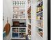 Walk-in pantry featuring custom shelving and storage space for organization at 255 Marjean Way, Alpharetta, GA 30009
