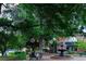 Beautiful park with lush green trees, outdoor seating, and a tranquil water fountain at 255 Marjean Way, Alpharetta, GA 30009