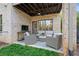 Relaxing outdoor patio with brick finish, ceiling fan and comfortable seating area at 255 Marjean Way, Alpharetta, GA 30009