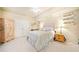 Cozy bedroom featuring a plush bed, wooden armoire, and decorative shelving with charming figurines at 239 Sumac Trl, Woodstock, GA 30188