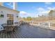 The outdoor deck boasts stunning views of the natural landscape and offers ample space for dining and entertaining at 239 Sumac Trl, Woodstock, GA 30188
