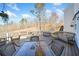 The outdoor deck provides multiple seating areas and overlooks a beautiful natural setting, perfect for relaxation and entertaining at 239 Sumac Trl, Woodstock, GA 30188