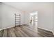 Cozy living room with hardwood floors, shelves and an open doorway to another room at 239 Sumac Trl, Woodstock, GA 30188