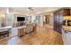 Spacious living room with hardwood floors, ceiling fan, and seamless flow into the dining area at 239 Sumac Trl, Woodstock, GA 30188