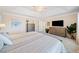 The main bedroom offers neutral paint, carpet floors, large windows, ceiling fan and plenty of room for storage at 239 Sumac Trl, Woodstock, GA 30188