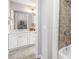 Bathroom with a tub shower, white cabinets, quartz countertops, and a tile shower at 4309 Elliott Way, Smyrna, GA 30082