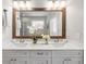 Bathroom featuring a dual sink vanity, a framed mirror, and modern fixtures at 4309 Elliott Way, Smyrna, GA 30082