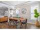 Bright dining room with elegant chandelier, hardwood floors, and access to living room at 4309 Elliott Way, Smyrna, GA 30082