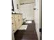 Cozy bathroom with a floral shower curtain, dark wood floors, and traditional vanity at 60 Saddle Tree Way, Sugar Hill, GA 30518