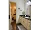 Well-lit bathroom featuring a granite countertop, decorative elements, and a separate vanity area at 60 Saddle Tree Way, Sugar Hill, GA 30518