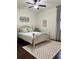 Cozy bedroom featuring a full bed, plush bedding, a neutral palette and soft rug at 60 Saddle Tree Way, Sugar Hill, GA 30518