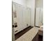 Spacious closet with floor-to-ceiling wardrobes, mirrored doors and soft carpet at 60 Saddle Tree Way, Sugar Hill, GA 30518