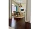 Elegant dining area with decorative chandelier, arched window, and plush turquoise drapes at 60 Saddle Tree Way, Sugar Hill, GA 30518