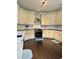 Well-appointed kitchen with stylish appliances, ample cabinet space, and tiled backsplash at 60 Saddle Tree Way, Sugar Hill, GA 30518