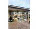 Cozy covered patio with outdoor seating, ceiling fan, and decorative hanging plants for relaxation at 60 Saddle Tree Way, Sugar Hill, GA 30518