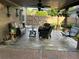 Relaxing outdoor patio with stylish furniture, ceiling fans, and lush hanging plants at 60 Saddle Tree Way, Sugar Hill, GA 30518