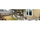 Spacious outdoor patio with a covered area, outdoor furniture, and well-maintained landscaping at 60 Saddle Tree Way, Sugar Hill, GA 30518