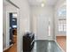 Bright entryway featuring neutral walls, stylish tile flooring, and convenient storage unit at 840 Cline Petty Way Way, Lawrenceville, GA 30043
