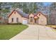 Inviting single-Gathering home featuring a well-manicured lawn and a convenient attached garage at 840 Cline Petty Way Way, Lawrenceville, GA 30043