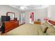 Spacious bedroom featuring hardwood floors and warm, comfortable furnishings at 840 Cline Petty Way Way, Lawrenceville, GA 30043