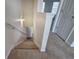 Carpeted staircase with a white handrail and a light fixture above the stairs at 107 Timber Ridge Dr, Cartersville, GA 30121