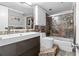 Updated bathroom with granite counters and a glass shower door at 130 26Th Nw St # 615, Atlanta, GA 30309