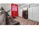 Cozy bedroom featuring a treadmill, wooden floors, and built-in shelving with a TV at 130 26Th Nw St # 615, Atlanta, GA 30309