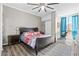 Comfortable bedroom featuring wood floors, a ceiling fan, and a dedicated workspace at 130 26Th Nw St # 615, Atlanta, GA 30309