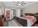 Bedroom boasts wood floors, ceiling fan, a king bed, a large closet, and in-unit washer and dryer at 130 26Th Nw St # 615, Atlanta, GA 30309