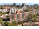 An exterior shot of the building on a sunny day with trees and a city view at 130 26Th Nw St # 615, Atlanta, GA 30309
