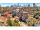 An exterior shot of the building on a sunny day with lush trees at 130 26Th Nw St # 615, Atlanta, GA 30309