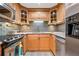 Updated kitchen with granite countertops, stainless steel appliances, and wood cabinetry at 130 26Th Nw St # 615, Atlanta, GA 30309