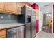Bright kitchen showcasing stainless steel appliances and modern backsplash with wood cabinets at 130 26Th Nw St # 615, Atlanta, GA 30309