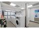 Communal laundry room with multiple washers and dryers for convenient resident use at 130 26Th Nw St # 615, Atlanta, GA 30309