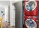 Bright laundry room with stackable red LG washer and dryer, offering space-saving convenience at 130 26Th Nw St # 615, Atlanta, GA 30309