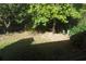 Secluded backyard is surrounded by mature trees, providing shade and privacy at 1932 Variations Ne Dr, Atlanta, GA 30329