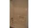 Bathroom features a clean shower with a built-in seat, offering a practical and accessible design at 1932 Variations Ne Dr, Atlanta, GA 30329