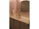 Bathroom featuring vanity with white cabinets, cream countertop, and an oval mirror at 1932 Variations Ne Dr, Atlanta, GA 30329