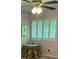 Bedroom with ceiling fan and window. Includes shutters, a round table and decorative fabric at 1932 Variations Ne Dr, Atlanta, GA 30329