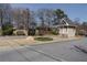 Community entrance with a sign and guard house, offering a secure and welcoming environment at 1932 Variations Ne Dr, Atlanta, GA 30329