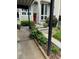 Two-story townhome with a red front door and newly planted flower beds, offering curb appeal at 1932 Variations Ne Dr, Atlanta, GA 30329