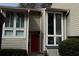 Inviting front entrance featuring a red door and large windows allowing for lots of natural light at 1932 Variations Ne Dr, Atlanta, GA 30329