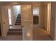 Carpeted living room showcasing the staircase and white decorative half wall at 1932 Variations Ne Dr, Atlanta, GA 30329