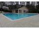 A community pool with a cabana building and pool-side seating at 1932 Variations Ne Dr, Atlanta, GA 30329