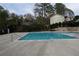 Community pool with stone retaining wall and mature trees at 1932 Variations Ne Dr, Atlanta, GA 30329