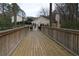 Wooden walkway leads to gated community area and amenities at 1932 Variations Ne Dr, Atlanta, GA 30329